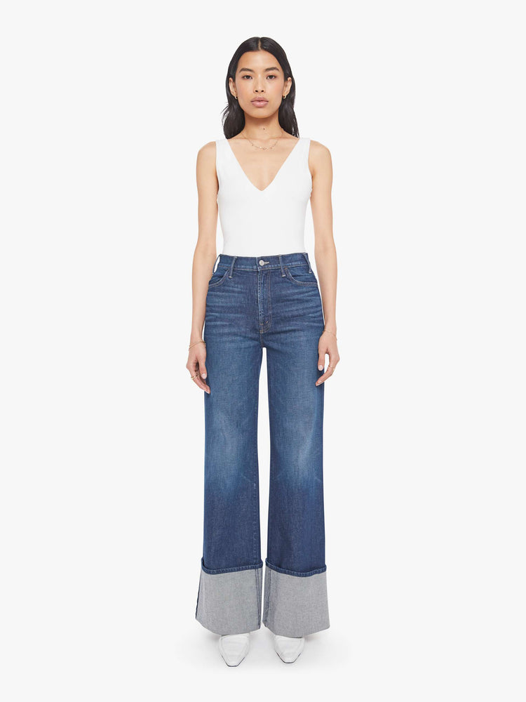 Front view of a woman wide leg jeans with a high rise, zip fly and a long 32-inch inseam with an extra-wide cuffed hem.