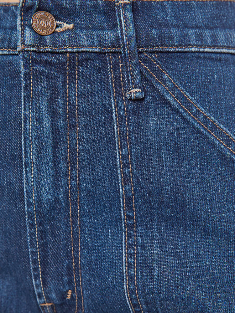 Swatch  view of a woman in a dark blue wide-leg jeans with a super high rise, oversized front patch pockets, seamed details throughout and a long 32-inch inseam with a clean hem.