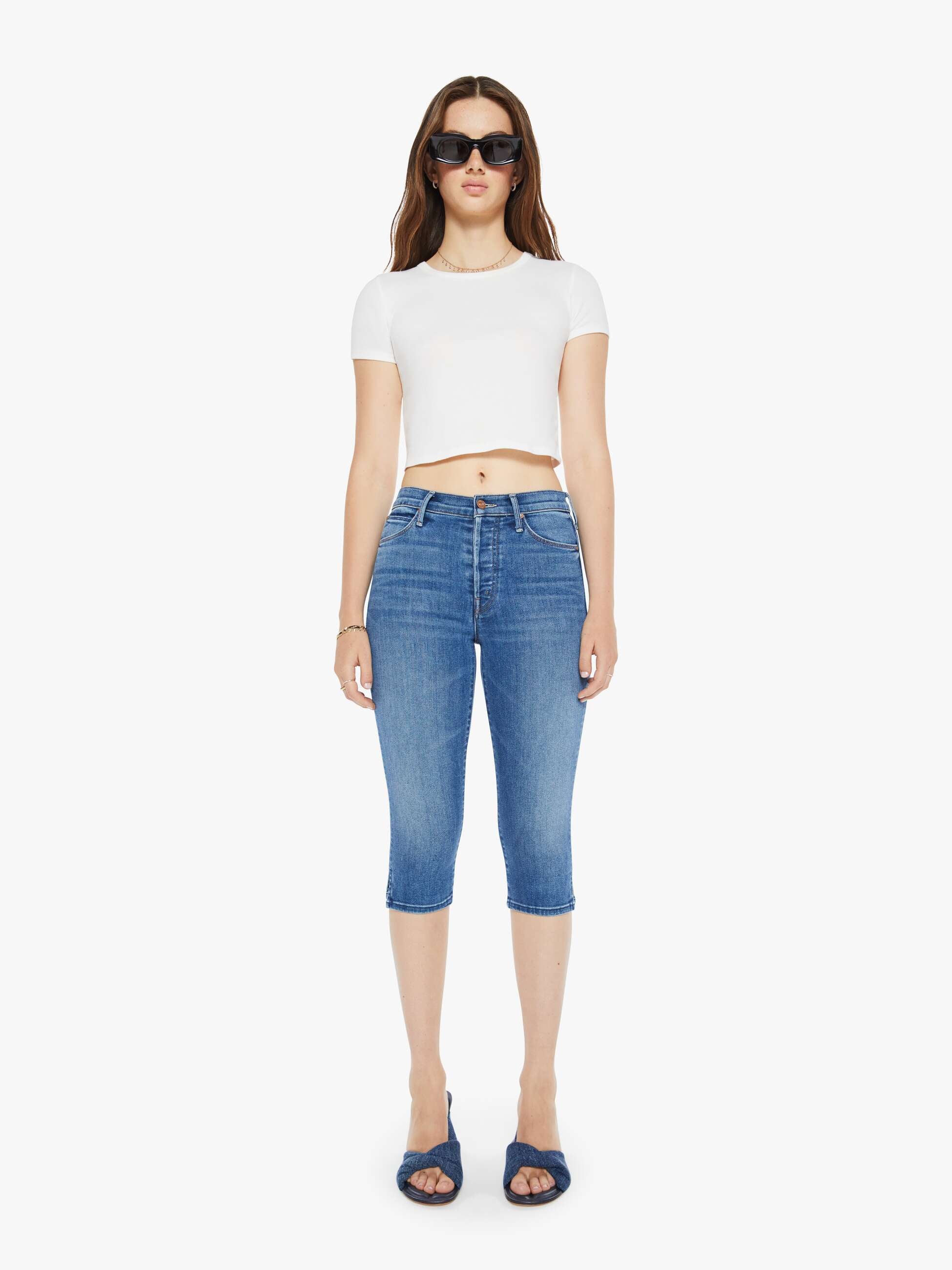 Mother High-waisted jeans with a skinny leg, zip fly and a capri-length inseam. Made from stretch denim, Connect The Dots is mid blue with whiskering and fading at the knee.