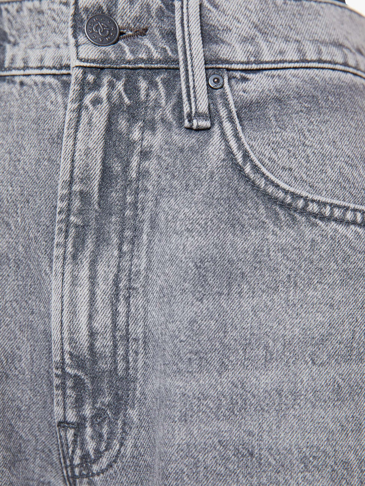 Swatch view of a woman in a super high-waisted jeans with a zip fly, curved, tapered leg and an ankle-length inseam with a clean hem.