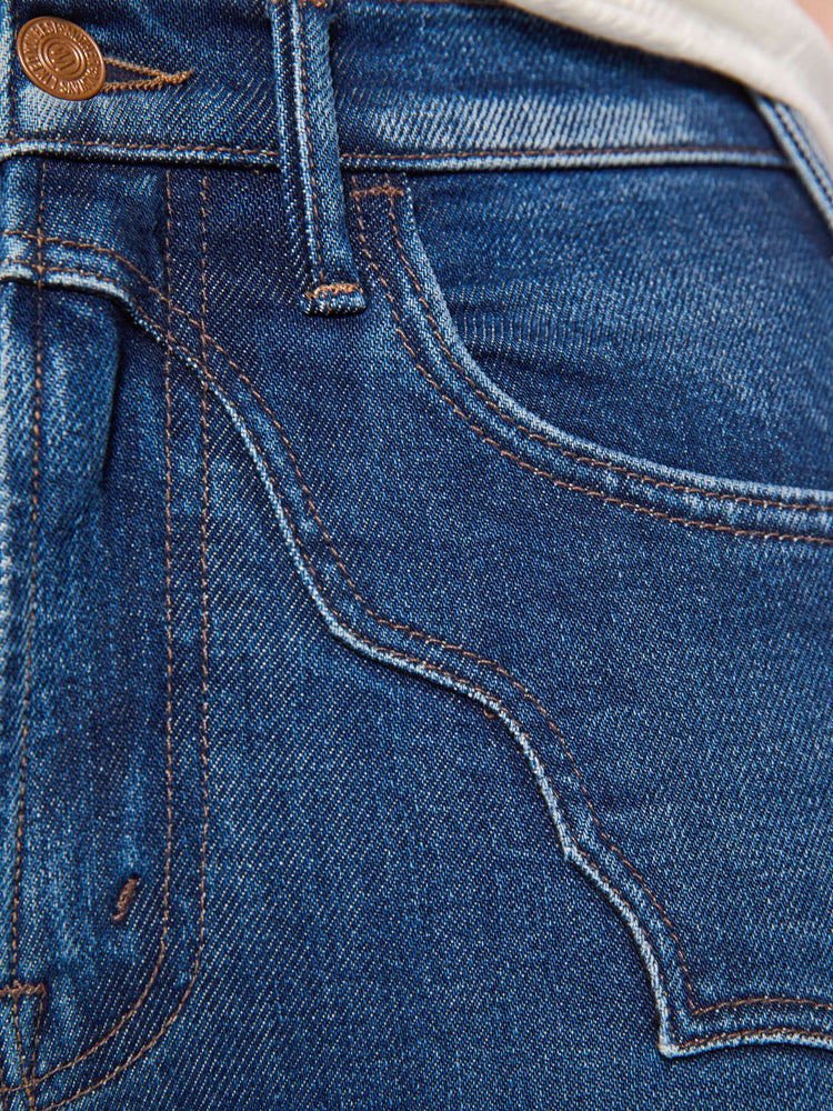 Swatch view of a woman in high-rise flare with Western-inspired details at the waist, a zip fly, 31-inch inseam and a clean hem.