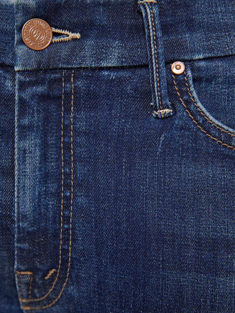 Swatch view of a woman in a dark blue skinny has a low rise with a zip fly, 29-inch inseam and a clean hem.
