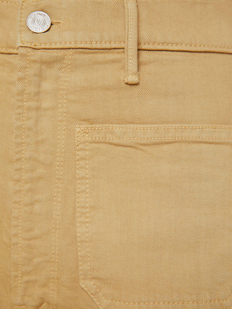 Swatch view of a woman in a  high-rise bootcut with a zip fly, patch pockets, looser leg and a long 32-inch inseam with a clean hem