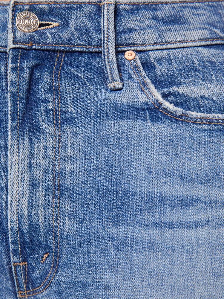Swatch view of a woman in a light blue high-rise straight-leg jeans with a 28.25-inch inseam and a clean hem.
