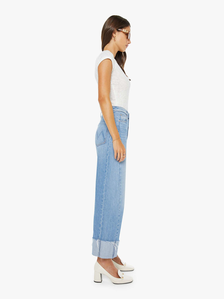 Side super high-waisted barrel jean with a zip fly, wide, curved leg and an ankle-length inseam with a cuffed, frayed hem.