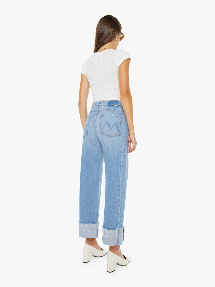 Back super high-waisted barrel jean with a zip fly, wide, curved leg and an ankle-length inseam with a cuffed, frayed hem.