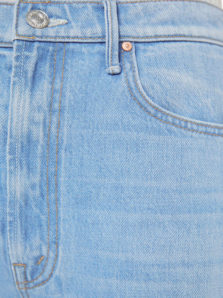 Swatch view super high-waisted barrel jean with a zip fly, wide, curved leg and an ankle-length inseam with a cuffed, frayed hem.