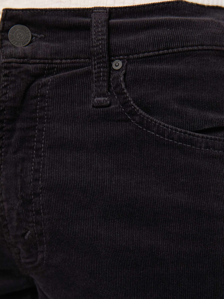 Swatch view of a woman in a black corduroy mid-rise straight-leg pants with a zip fly, ankle-length inseam and a clean hem.