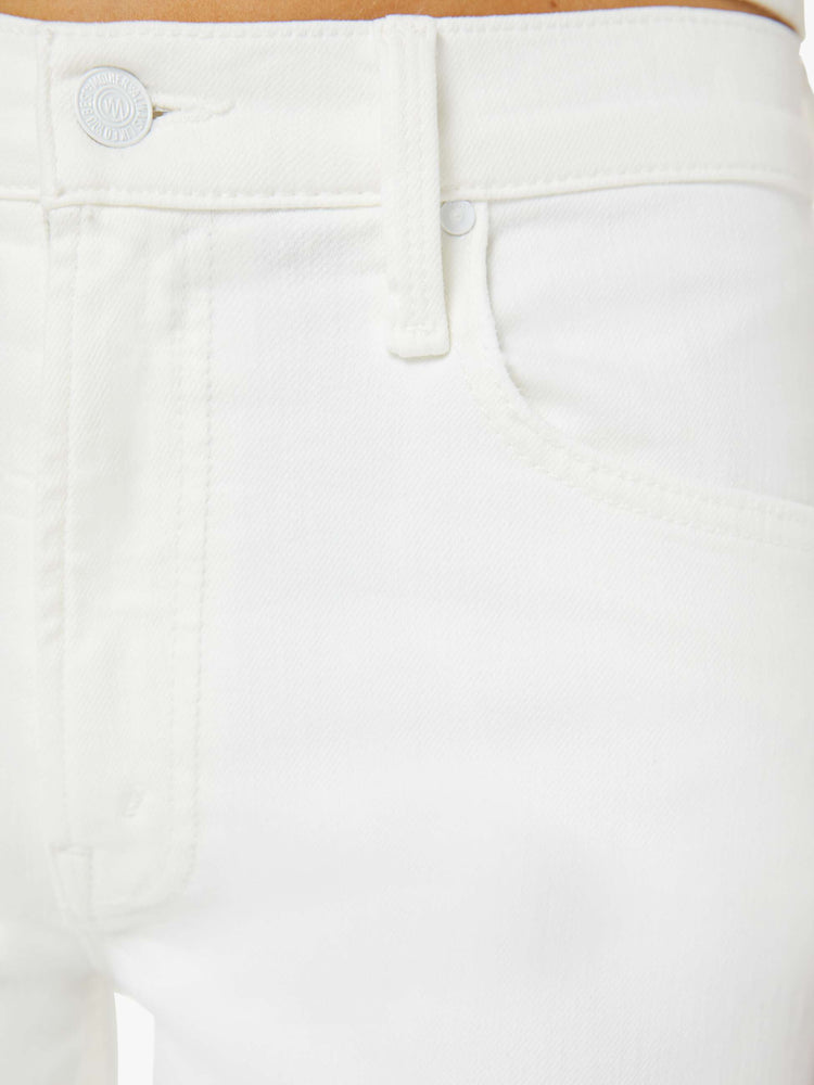 Swatch view of a woman in a white high-rise jeans with a straight leg, zip fly and an ankle-length inseam with a clean hem. 