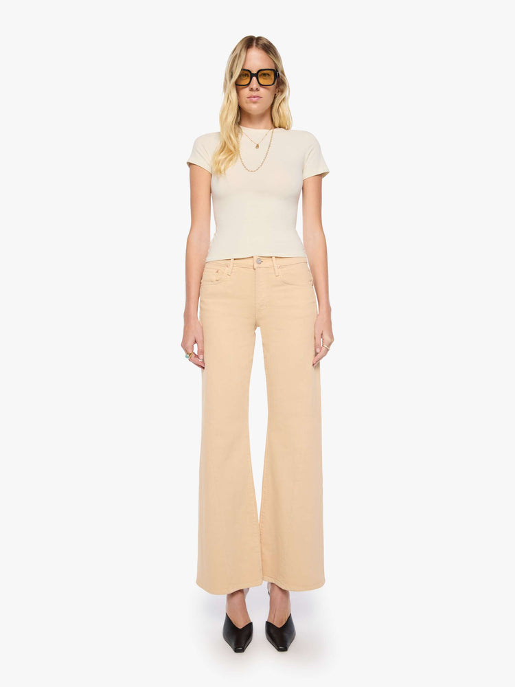 Front view of a woman in a soft khaki mid-rise wide leg with a zip fly, 32-inch inseam and a clean hem.