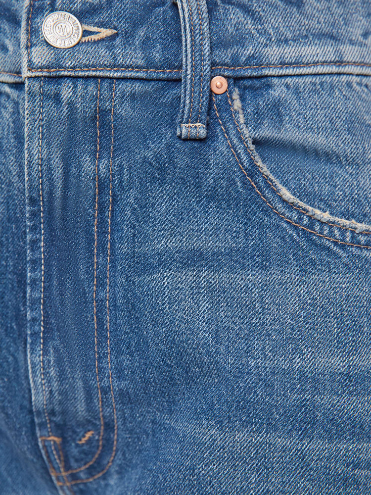 Swatch  view of a woman in a super high-waisted barrel-leg jeans with a zip fly, ankle-length inseam and a clean hem.