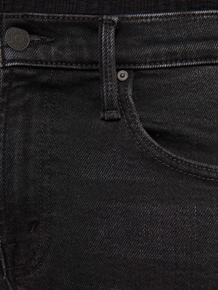 Swatch view of a woman in mid-rise bootcut jean with a long 32-inch inseam and a clean hem.