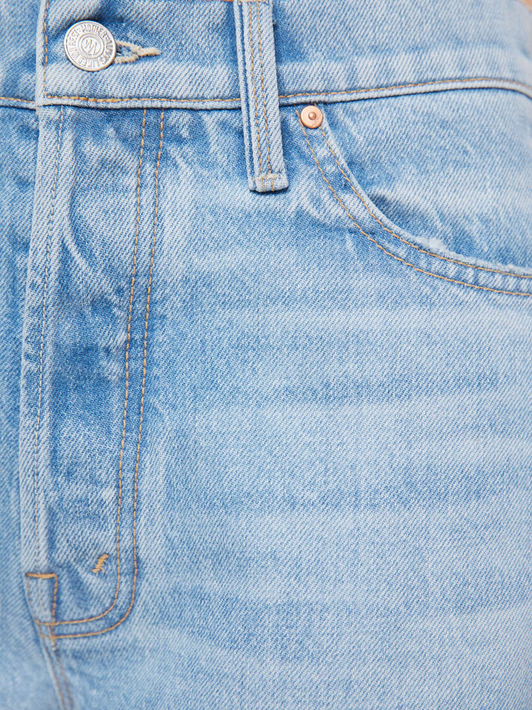 Swatch view of a woman in a light blue jean designed to sit on the hips with a slouchy fit, loose straight leg, button fly and a 29-inch inseam with a clean, untacked cuffed hem.