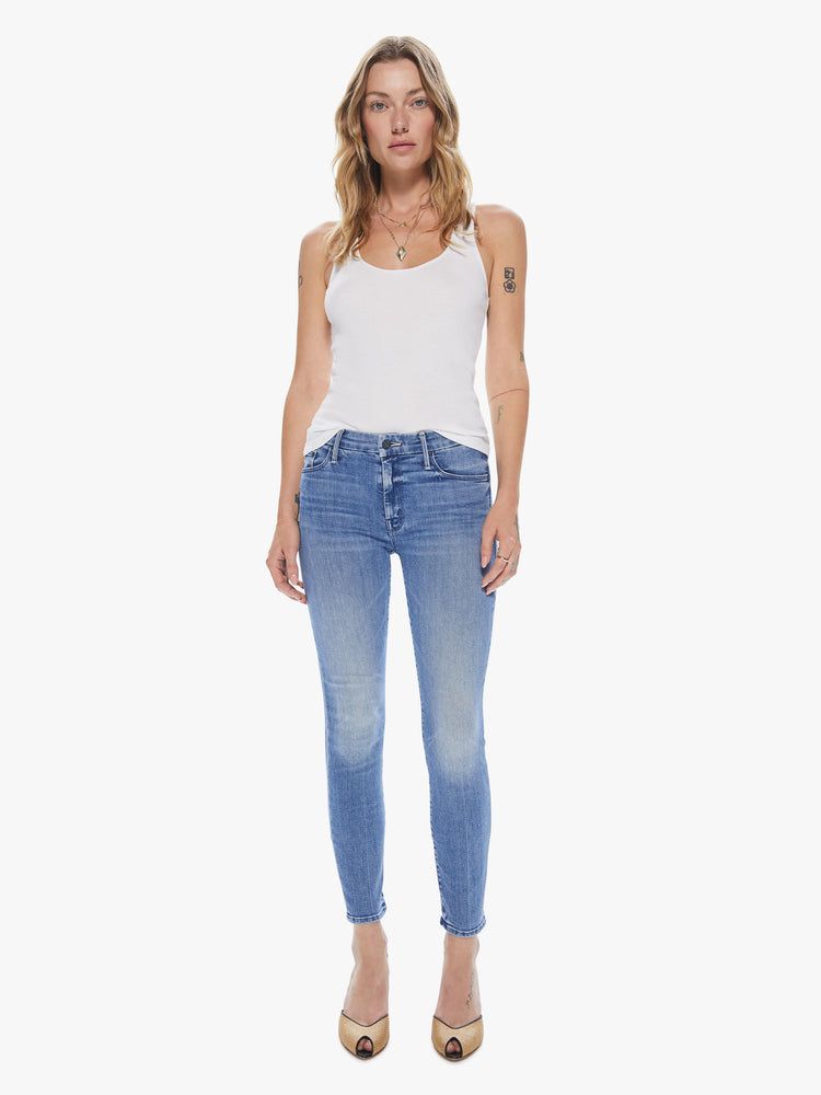 Front view women's blue mid rise skinny denim.