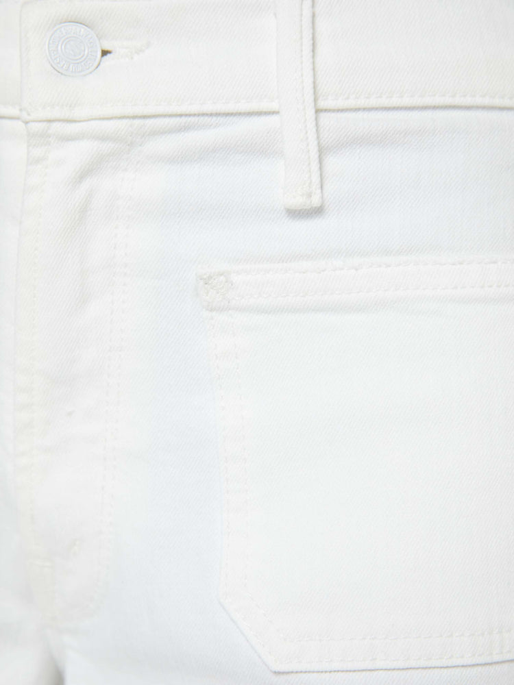 Swatch view of a woman in a white id-rise jeans with a loose fit, zip fly, wide leg, patch pockets and ankle-length inseam with a clean hem.