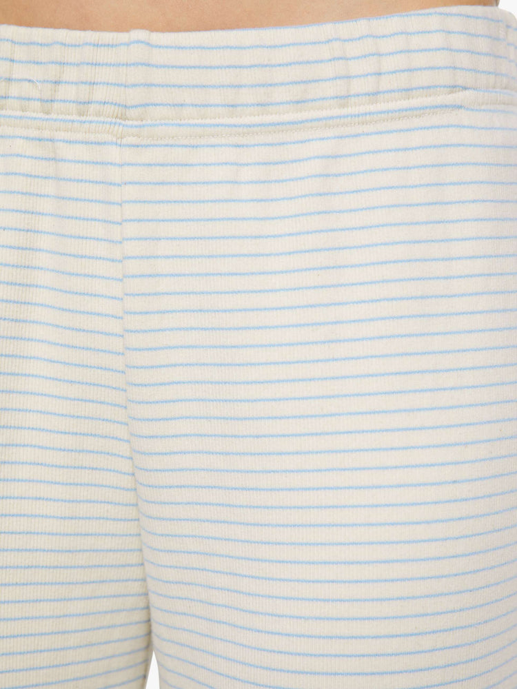 Swatch view of woman in a white with light blue horizontal stripes wide-leg pants with an elastic waistband and a loose, comfortable fit. 
