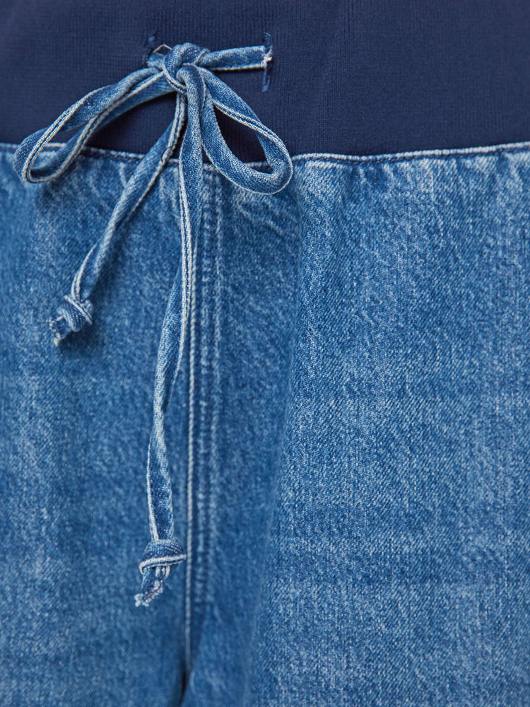 Swatch  view of a woman in a high-waisted wide-leg jeans are designed with a drawstring elastic waistband, slit pockets and a 32-inch inseam with a clean hem.