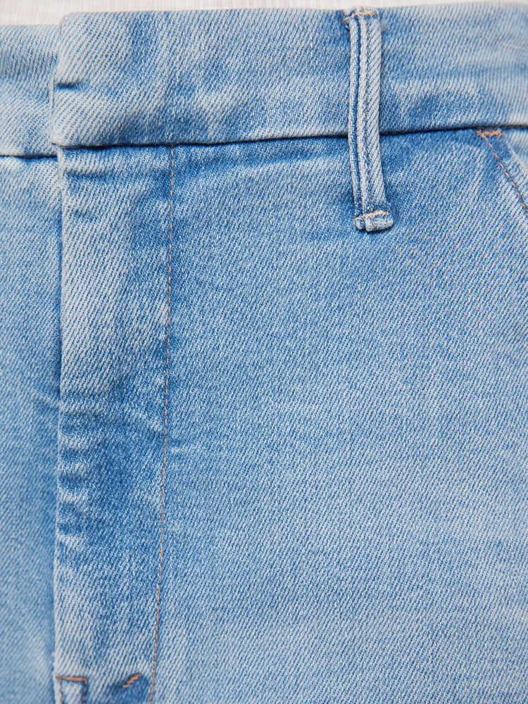 Swatch view of a woman in wide-leg pants designed to sit lower on the hips with a high rise, slit pockets, a zip fly, relaxed fit and an ankle-length inseam with a clean hem.