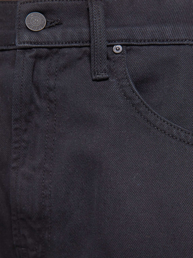 Swatch view of a woman in a black jeans designed to sit lower on the hips with a 28.5-inch inseam, zip fly, clean hem and slightly tapered leg.