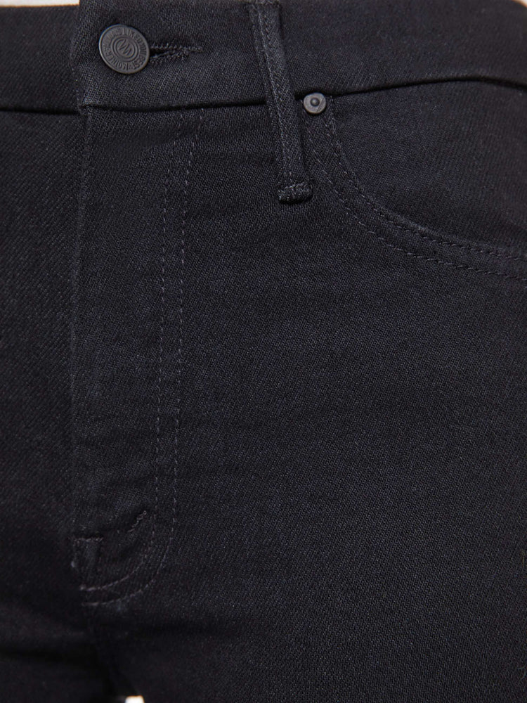 Swatch view of a woman in a black skinny with a high rise with a 29-inch inseam and a clean hem.