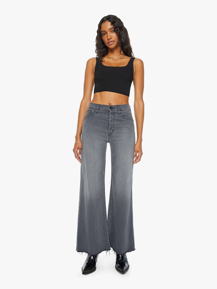 Front view of women's grey high waisted wide leg jean with a frayed hem