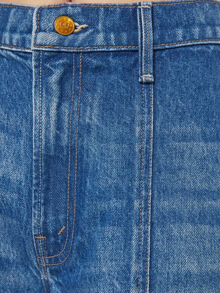 Swatch view of a woman in a mid blue  high-waisted pants have a zip fly, loose, wide leg with seamed details down the front and a 28.5-inch inseam with a clean hem. 