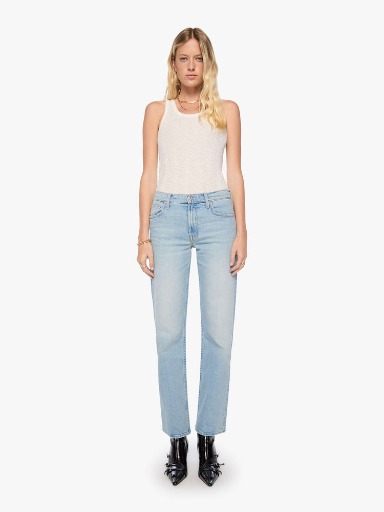Front view of a woman in a light blue mid-rise straight-leg pants with a zip fly, long 32-inch inseam and a clean hem.