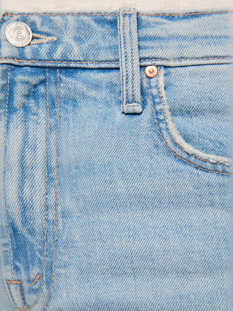 Swatch view of a woman in a light blue mid-rise straight-leg pants with a zip fly, long 32-inch inseam and a clean hem.