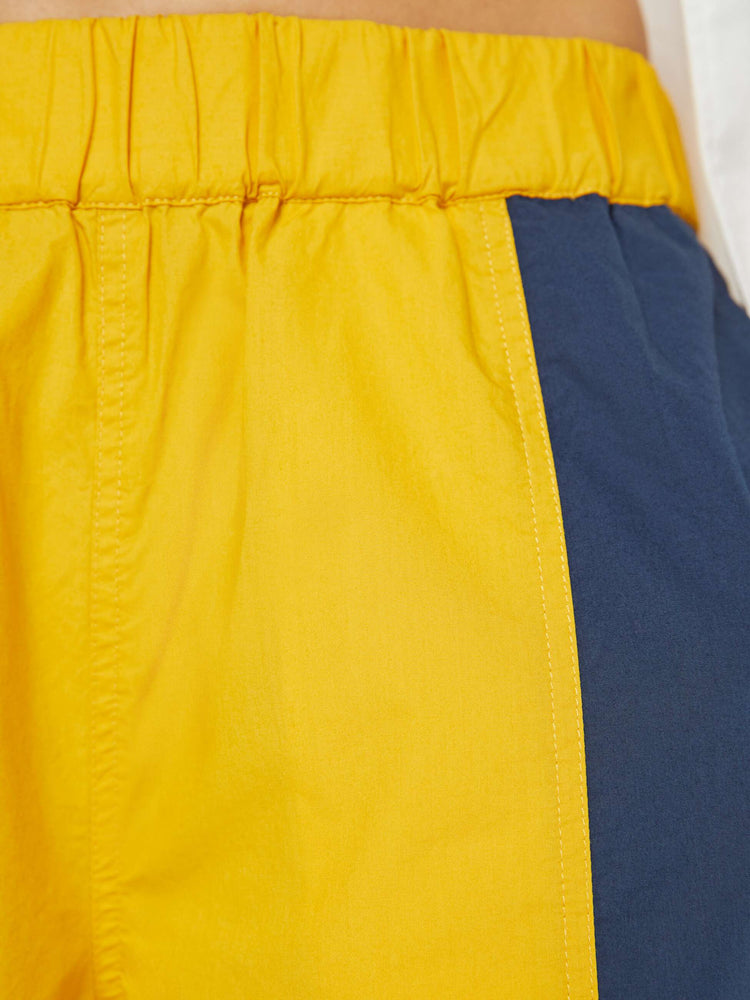 Swatch view of a woman high-rise sweatpants with an elastic waistband, slit pockets and a loose, straight leg with a long inseam and elastic hems.