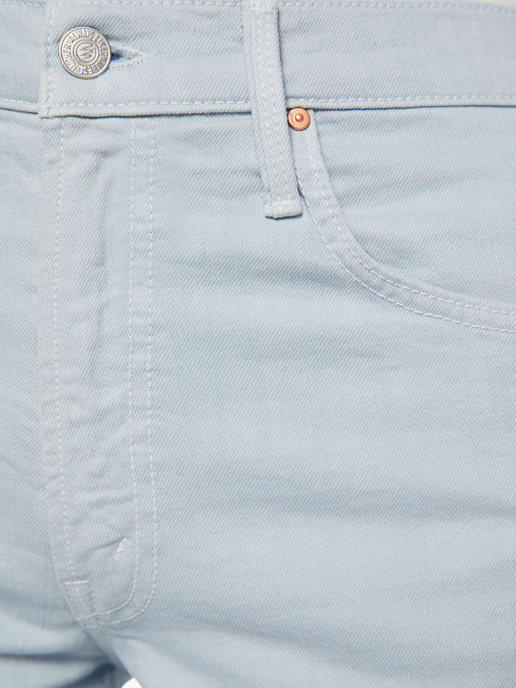 Swatch view of a woman in a light blue high-waisted wide leg jeans with a zip fly, long 33 1/4-inch inseam and loose, low-slung fit.