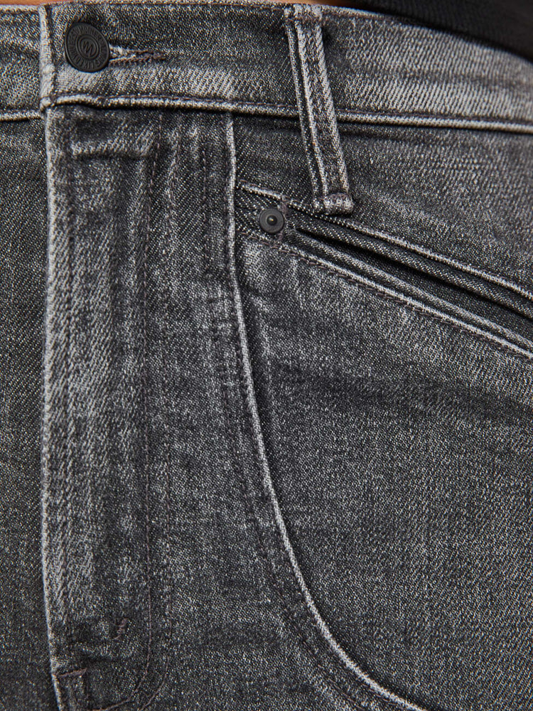 Swatch view of a woman in a dark grey high-rise jeans with a straight leg, zip fly, curved patch pockets with slit openings and a 32-inch inseam with a clean hem.