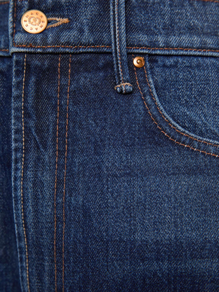 Swatch view of a woman in a super high-waisted jeans are designed with a zip fly, an inset panel on the outer seam, slightly tapered leg, 30-inch inseam, clean hem and a relaxed fit. 
