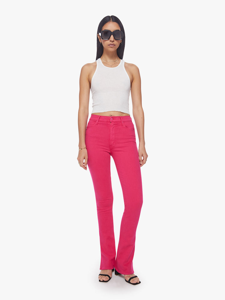 Front view of a classic skinny flare with a high rise and a full-length inseam with a sliced hem in a hot pink hue.