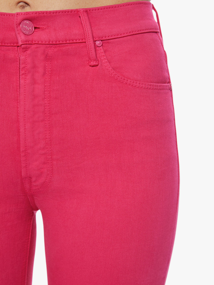 Front waist view of a classic skinny flare with a high rise and a full-length inseam with a sliced hem in a hot pink hue.