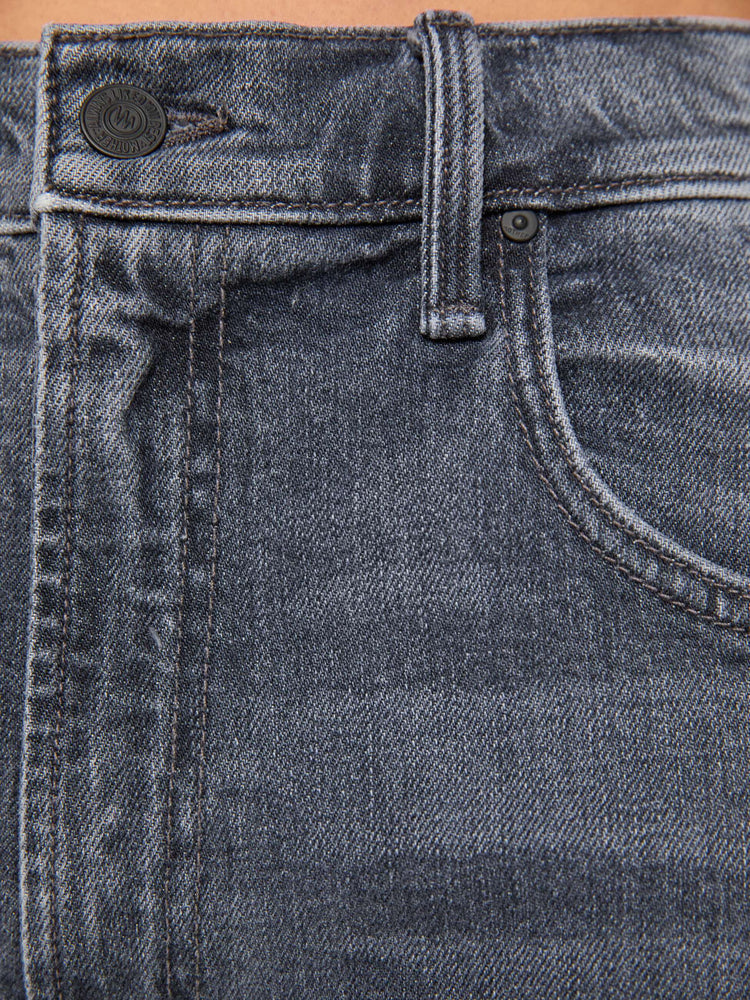 Swatch view of a grey washed jeans designed to sit lower on the hips with a zip fly, slightly tapered leg and a 31-inch inseam with a clean hem.