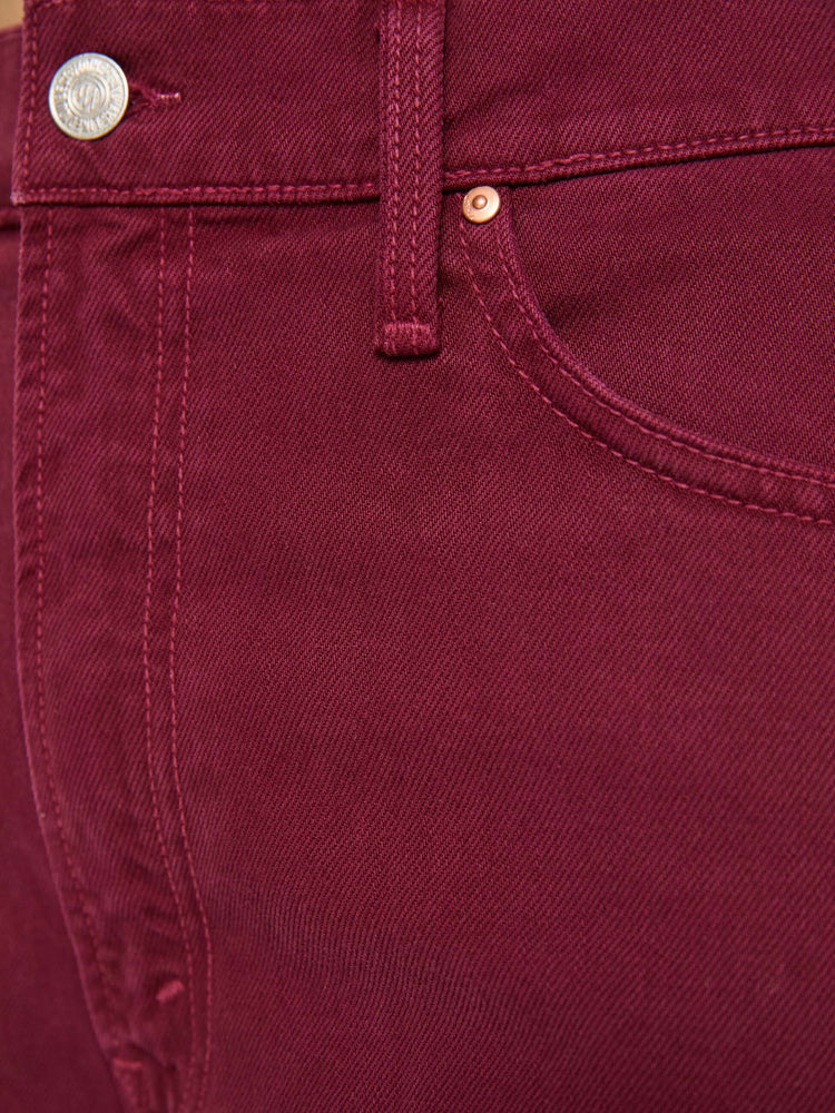 Swatch view of a woman in pants designed to sit lower on the hips with a mid rise, zip fly, loose straight leg and a clean 31-inch inseam with a cuffed hem.