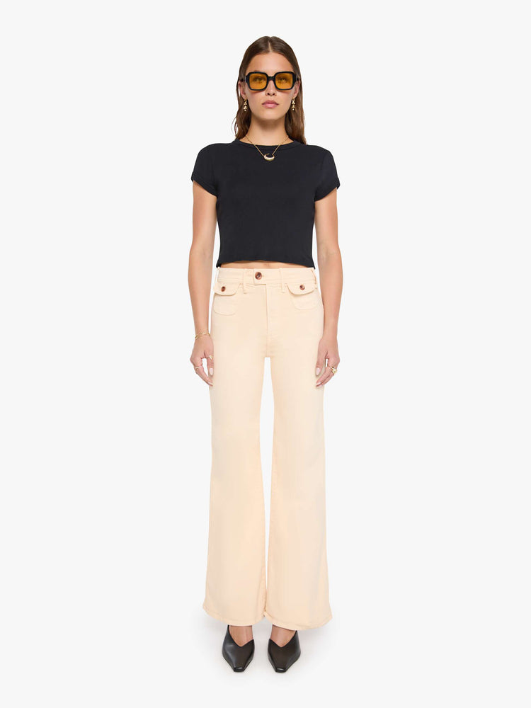 Front view of a peachy khaki wide leg jeans with a high rise, zip fly, button-tab waistband, miniature patch pockets, a 32-inch inseam and a clean hem.