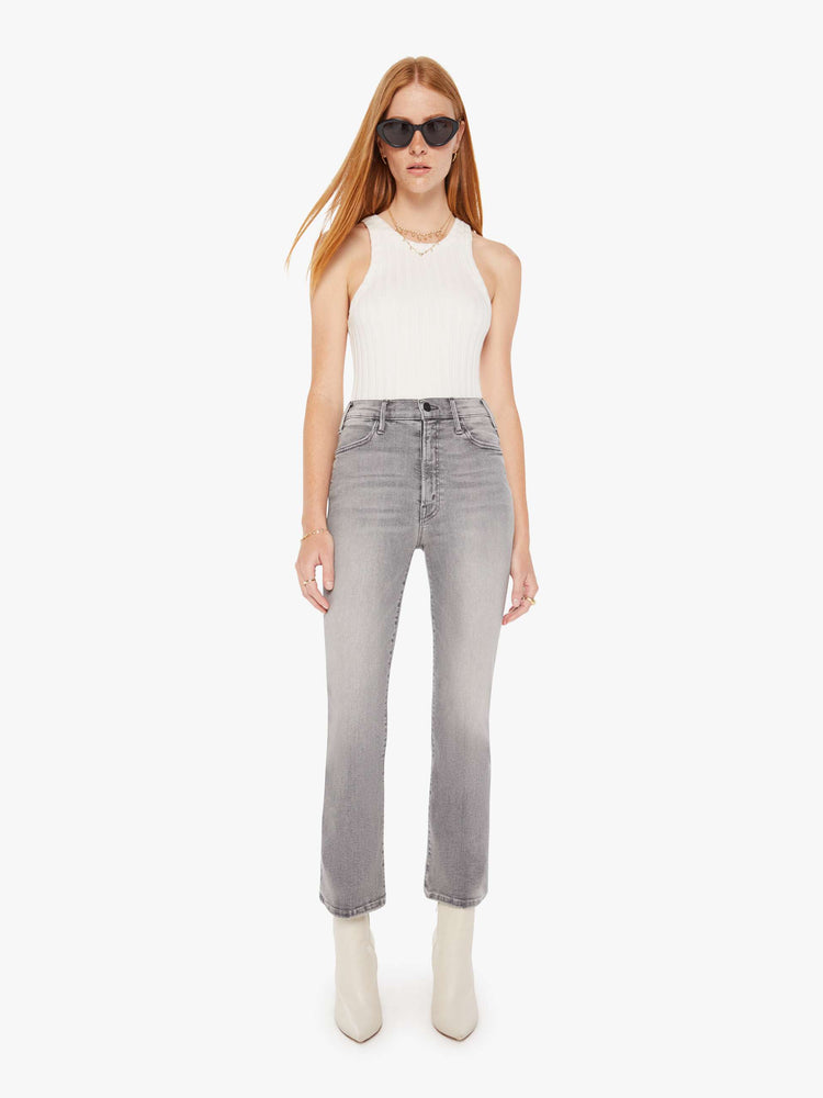 Front view of a womens grey wash jean featuring a high rise and an ankle length flare leg.