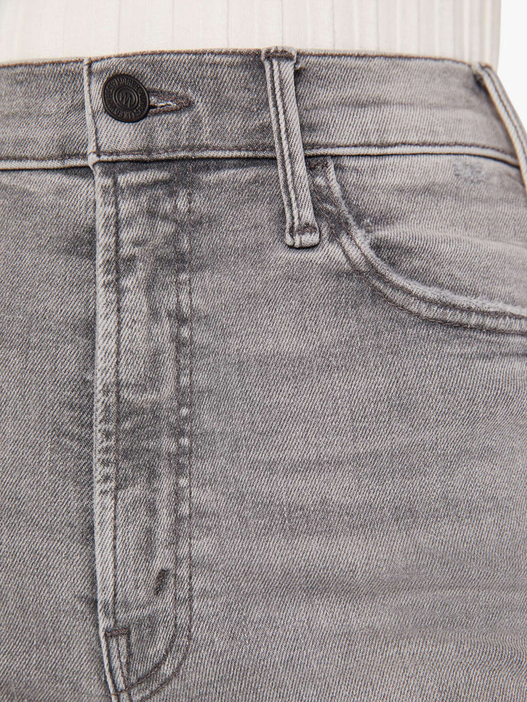 Close up swatch view of a grey wash jean.