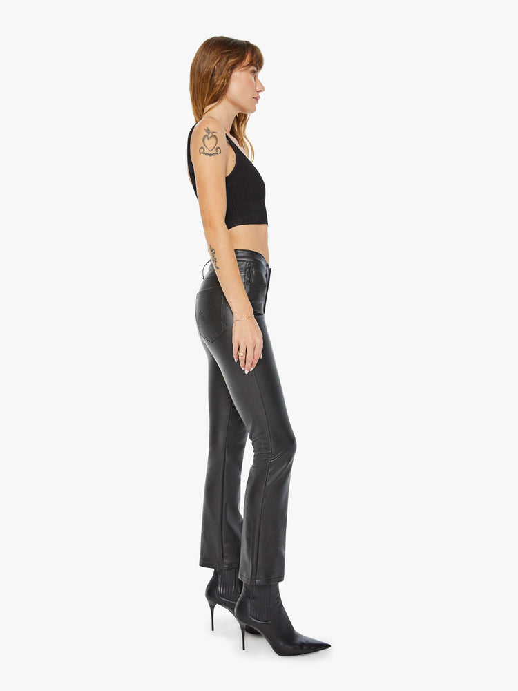 Side view of women’s faux leather ankle length bootcut pant.