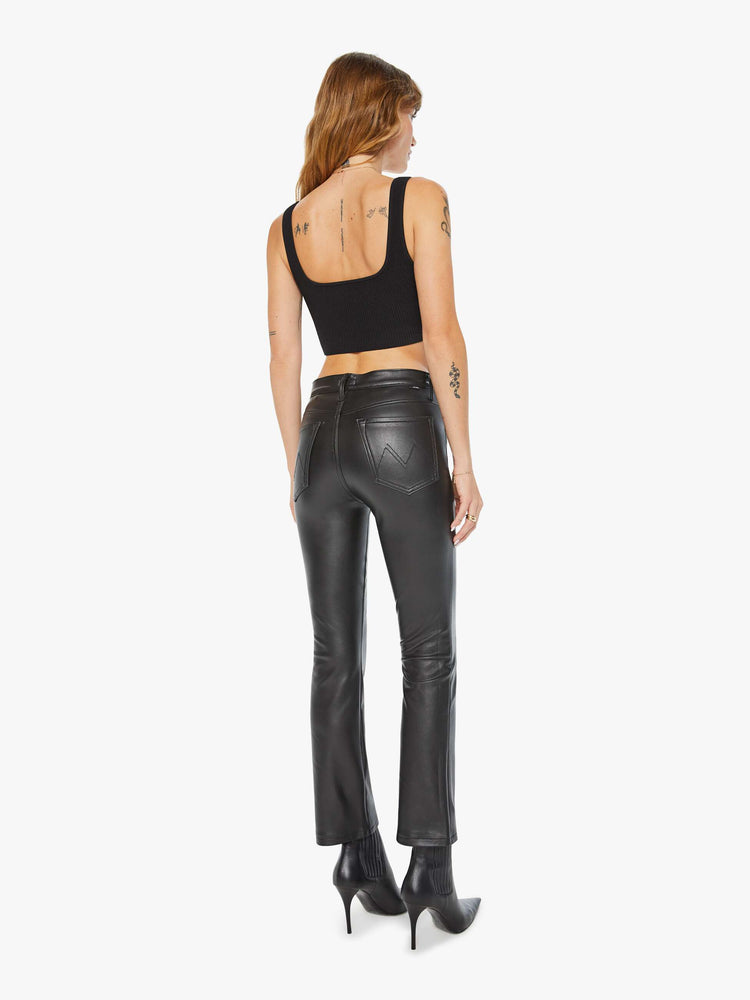 Back view of women’s faux leather ankle length bootcut pant.