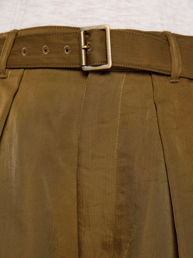 Swatch view of a woman in a bronze super high-waisted pants with a belted waistband, zip fly, curved leg, slit pockets, pleats for an even wider fit, and a long inseam with a clean hem.