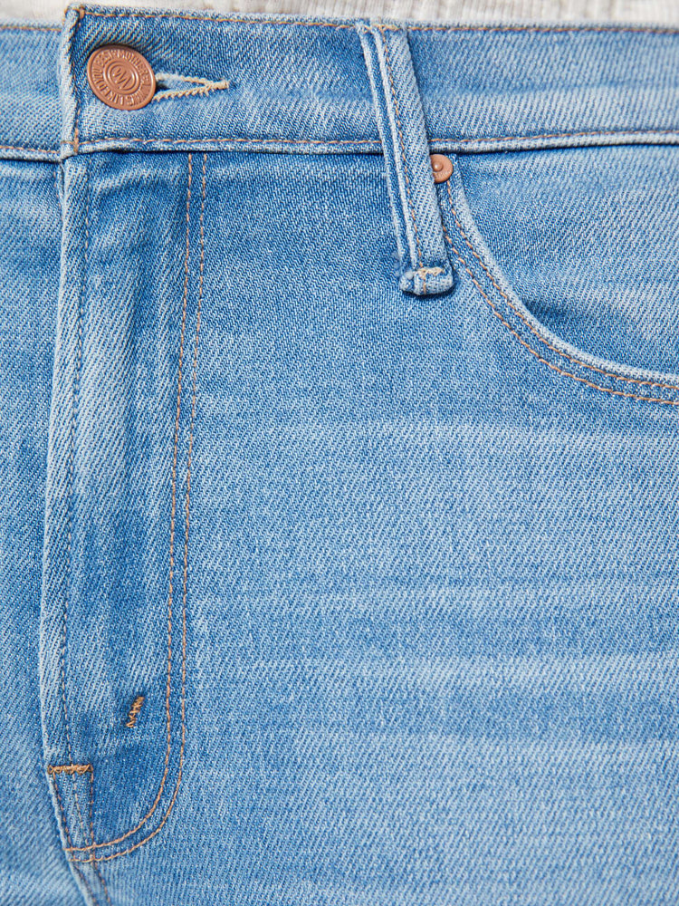 Swatch view of a woman in a light blue high-rise flare with a zip fly, long 34-inch inseam and a clean hem.