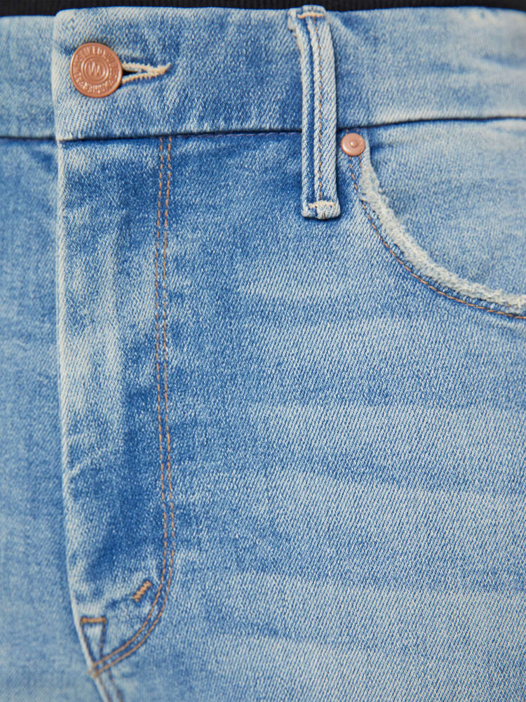 Detail view of a light blue wash jean.