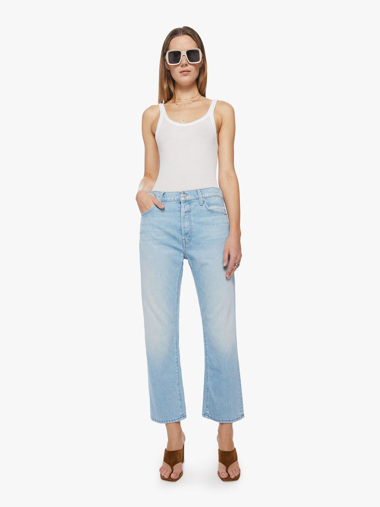 Front view of a woman cropped jeans with a button fly, slouchy straight leg and relaxed fit in a light blue.