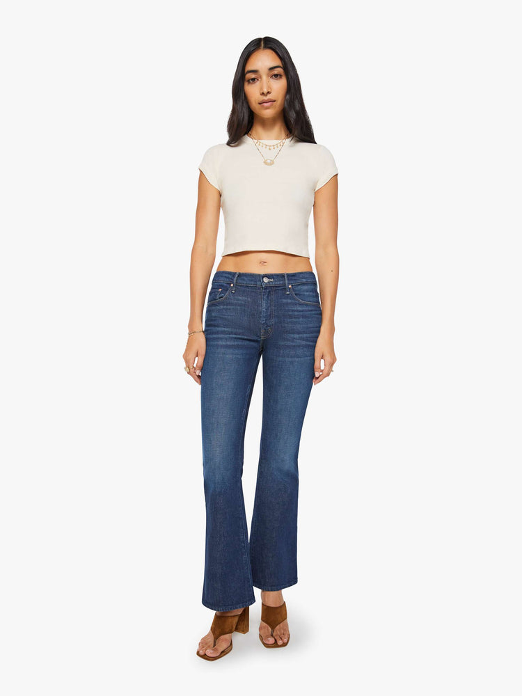 Front view of a dark blue mid rise jean with a 31-inch inseam and a clean hem.