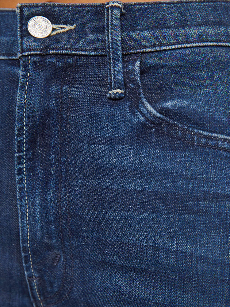 Swatch view of a woman high-waisted wide-leg jeans with a long inseam and a thick side-slit hem in a dark blue wash.