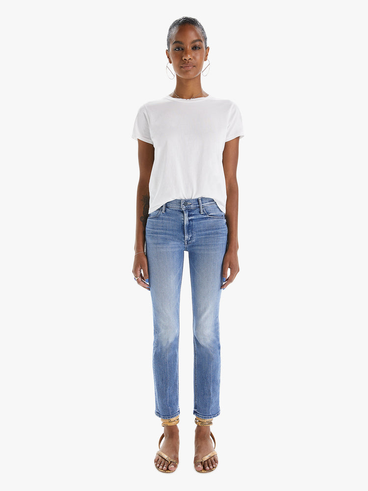 Front view of a womens classic medium blue wash denim jean featuring a mid rise, a slim straight leg, an ankle length clean hem, and subtle whiskering details.