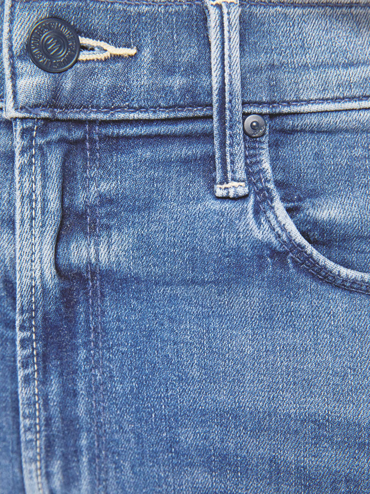 Swatch view of a womens classic medium blue wash denim jean featuring a mid rise, a slim straight leg, an ankle length clean hem, and subtle whiskering details.