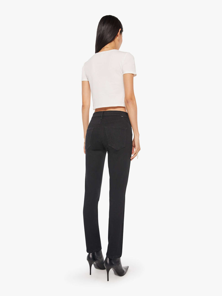 Back view of a woman a black mid-rise straight leg with an ankle-length inseam and a clean hem.